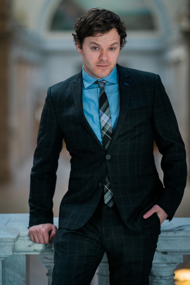 Grandparents embracing grandchild