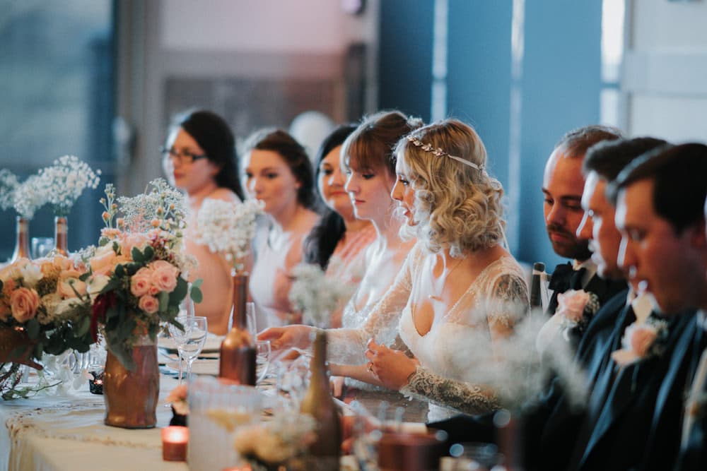 Bride and groom walking through a garden